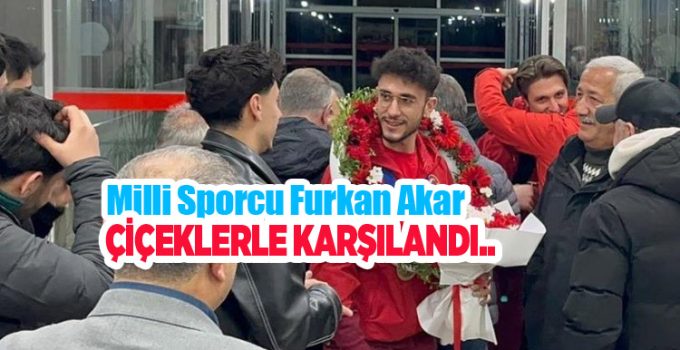 Milli sporcu Furkan Akar çiçeklerle karşılandı…