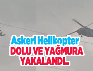 Askeri helikopter dolu ve yağmura yakalandı..