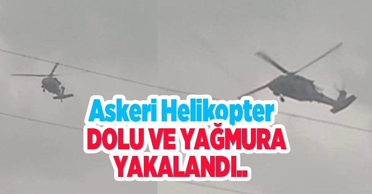 Askeri helikopter dolu ve yağmura yakalandı..